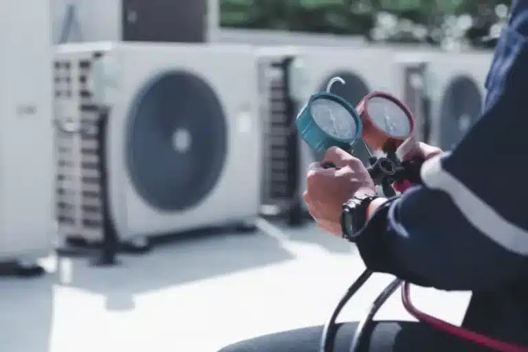 Technician doing a heating and cooling assessment