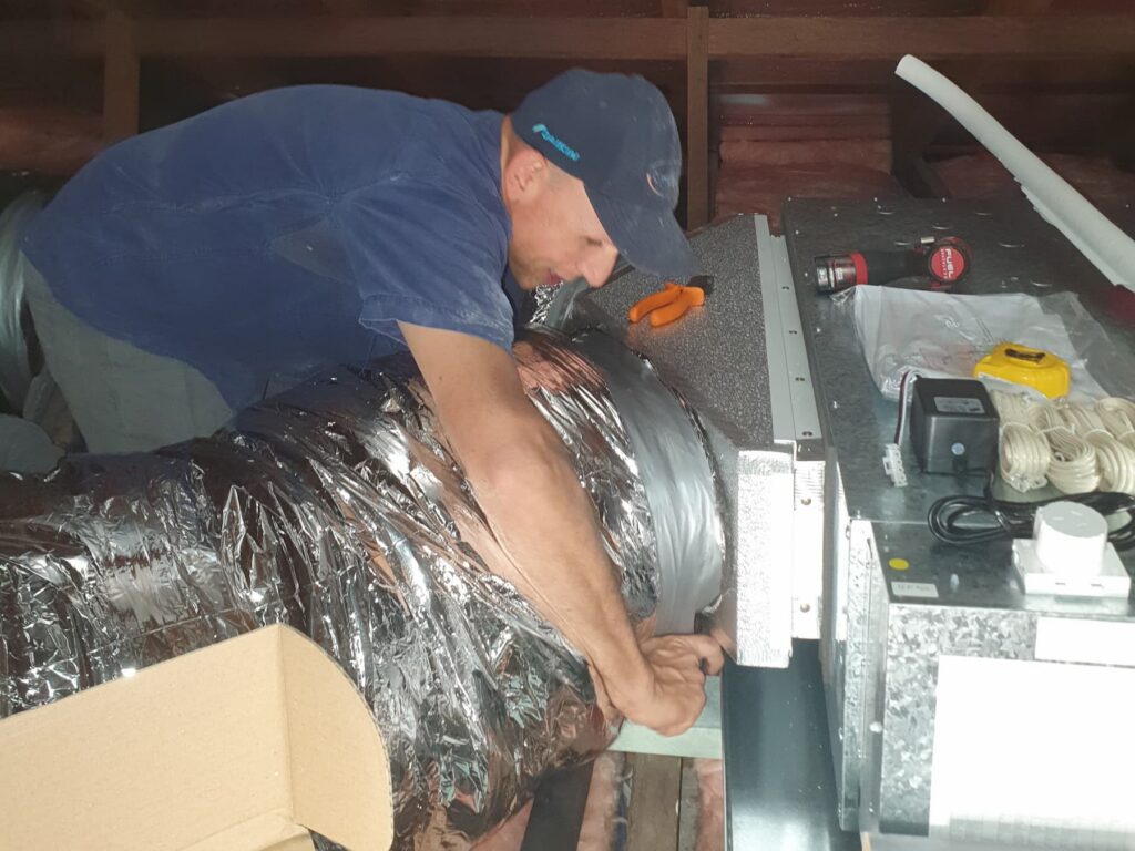 ClimateLink team installing ducted aircon
